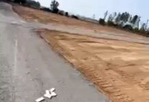 Công an làm việc với thanh niên ngồi xe rải từng cọc tiền xuống đường ‘cho đất ăn tiền’